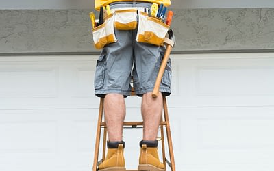 Roofer inspecting a roof in a ladder