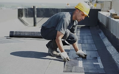 Professional roofer doing a commercial roof inspections